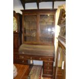 A George IV mahogany cylinder bureau bookcase,