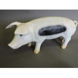 A cast resin garden pig, H. 23cm.