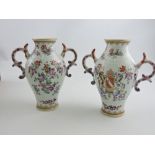 A pair of Chinese armorial vases, of baluster form with twin handles, H. 13cm, (2).
