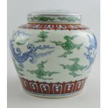 A Doucai style ginger jar and cover decorated with dragons among clouds, H. 12cm.