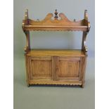 A late Victorian walnut hanging wall cabinet,