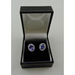 A pair of tanzanite and diamond ear studs, the central stone approx. 2.