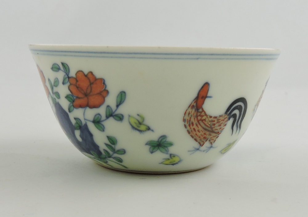 Doucai style bowl, decorated with chickens, with a six character mark to base, D, 8cm.