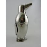 A bright metal cocktail shaker in the form of a penguin, H. 20cm.