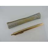 A Pelikan ball pen, with an engine turned yellow metal body stamped 14K, 19.9g. all in.
