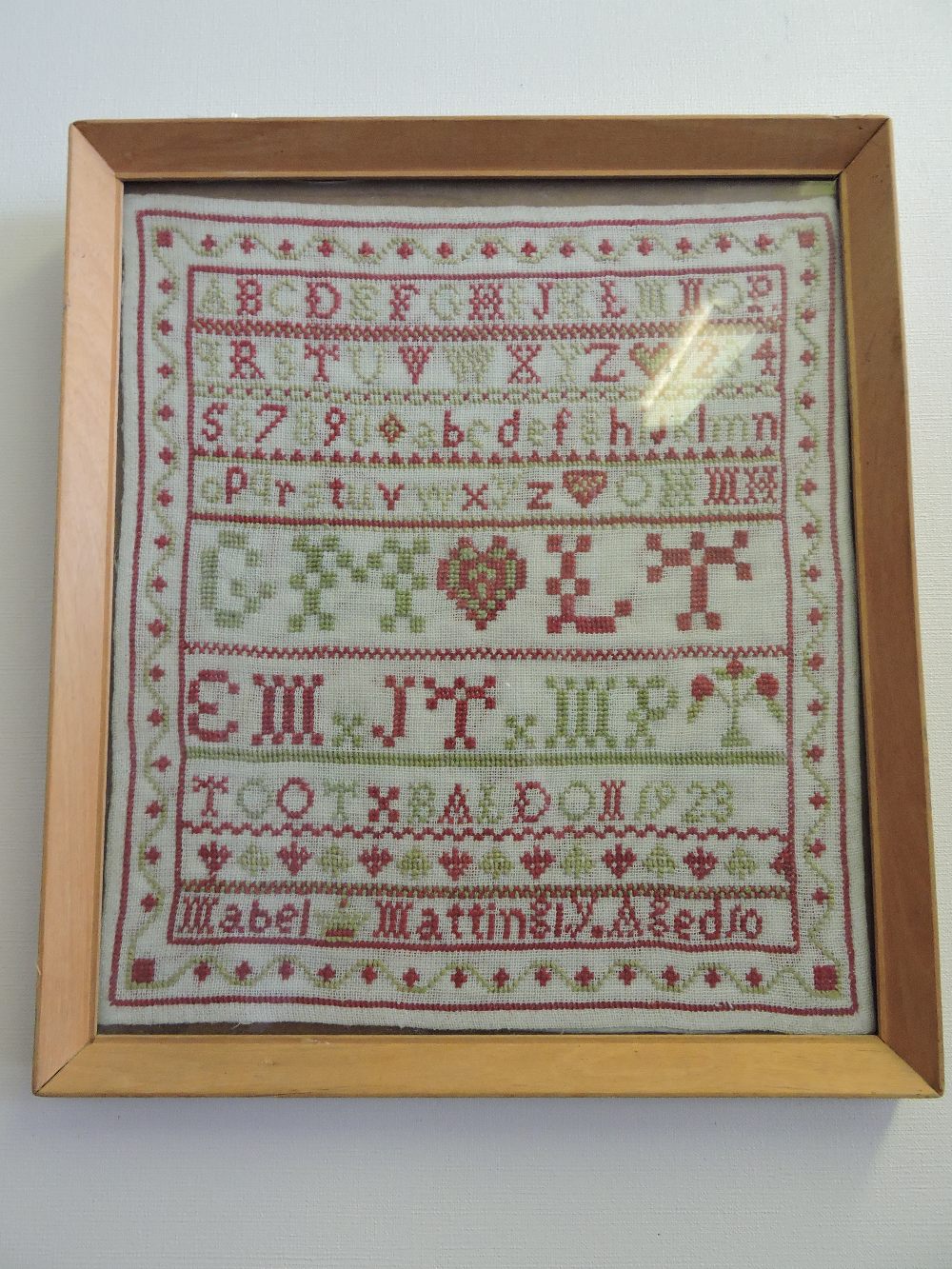 An early 20th century sampler, by Mable Martin aged 10,