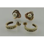 A pair of yellow metal and pearl ear studs, together with another pair set with white stones,