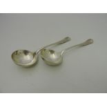 A pair of silver rat-tail ladles, Sheffield 1923 by Harrison and Howson, 6.58ozt.