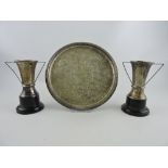 A pair of silver trophy vases, Birmingham 1982, on ebonised curricular bases, H.