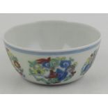 A Ming style polychrome decorated porcelain tea bowl, bears six character mark to base. D.
