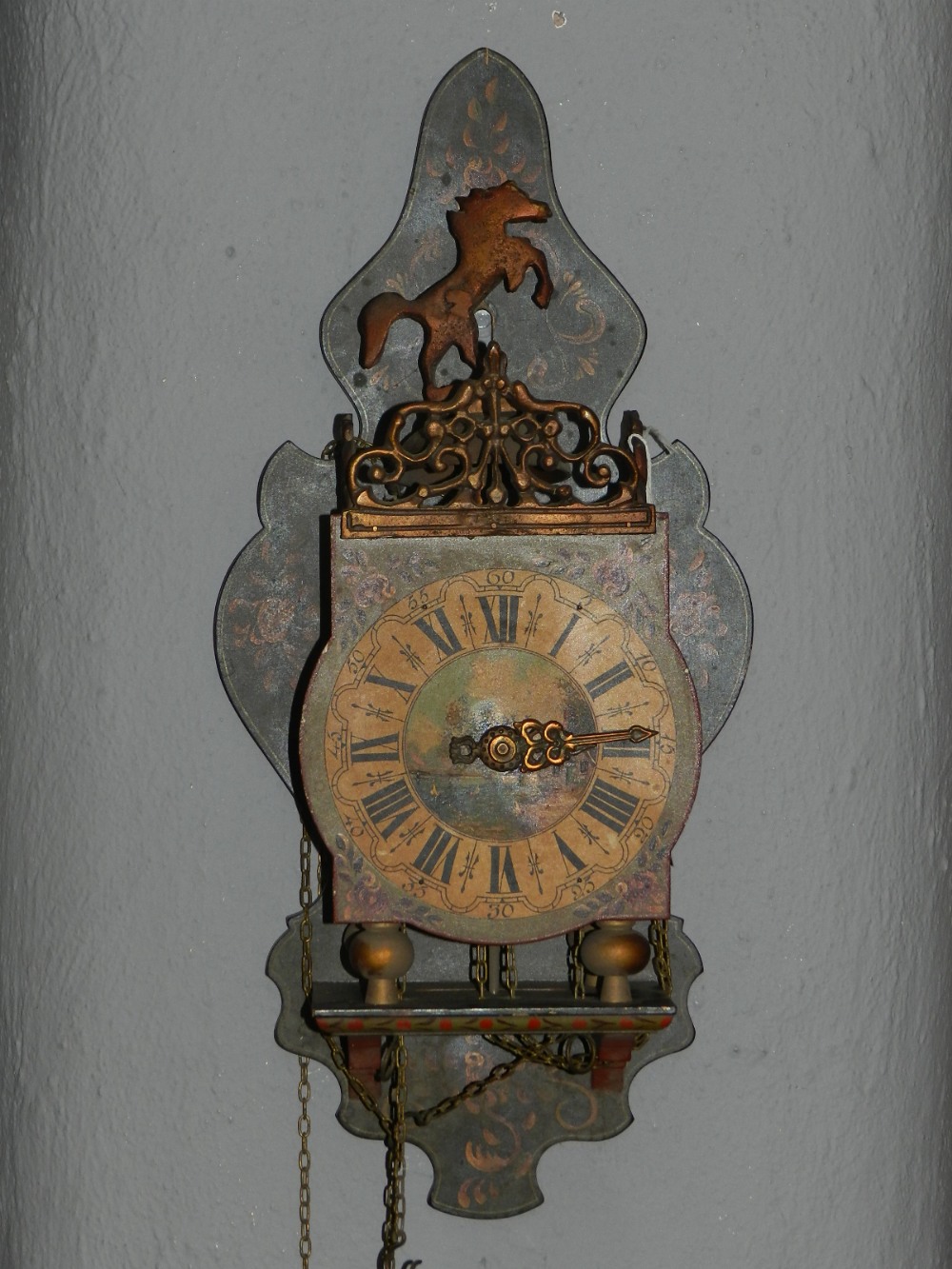 A 19th century bracket clock, having hand painted Roman dial, with horse finial top, striking bell,