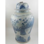 A pair of Chinese blue and white jars and covers, decorated with noblemen.