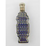 A 19th century porcelain scent bottle of cartouche form, painted with enamel roundels and motifs,