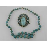 A gilt metal and turquoise set necklace