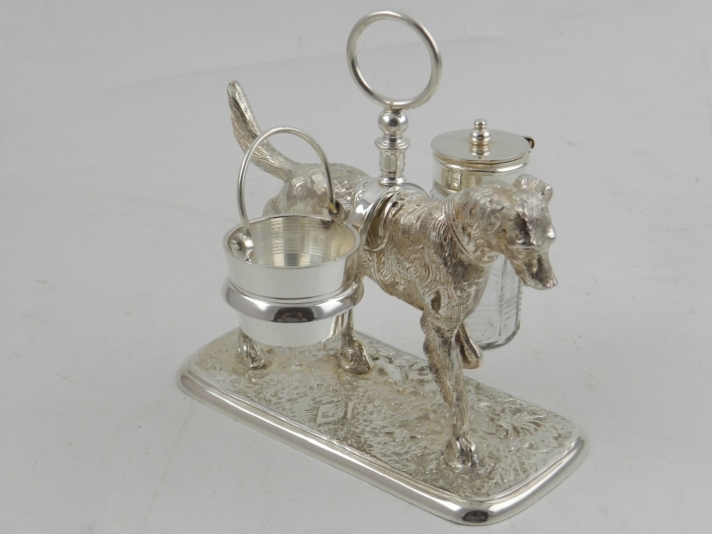 A silver plated novelty condiment set, in the form of a dog.