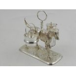 A silver plated novelty condiment set, in the form of a dog.