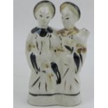 A Chinese porclelain figurine of two noblemen. H.