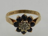 A 9 carat yellow gold, diamond and sapphire floral cluster ring.