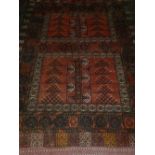 An early 20th century Turkoman carpet, decorated with geometric pattern within many borders. L.210cm