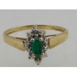 A 9 carat yellow gold and emerald ring.