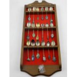 A collection of novelty silver and white metal teaspoons, various hallmarks.