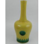 A Chinese porcelain bell shaped vase, decorated with jagged green border and circles to centre,