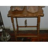 An early 20th century oak occasional table with a shaped rectangular top and barley twist