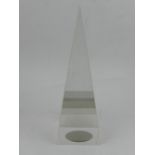 A glass sculpture of a prism, signed. H.