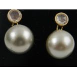 A pair of 18 carat yellow gold, diamond, and South Sea pearl drop earrings, the grey pearls each