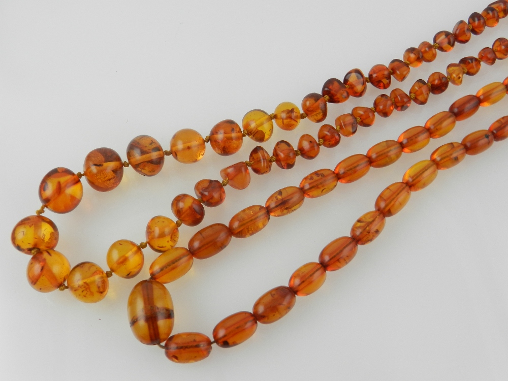 Two amber style beaded necklaces.