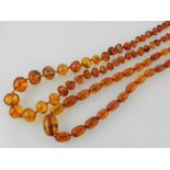 Two amber style beaded necklaces.