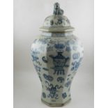 A pair of Chinese blue and white octagonal porcelain vases, having dogs of Fo to covers,