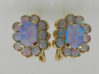 A pair of 14 carat yellow gold and blue opalite cluster earrings.