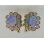 A pair of 14 carat yellow gold and blue opalite cluster earrings.