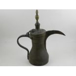 A Middle Eastern brass ewer. H.36cm