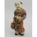 A ceramic study of a Chinese figure. H.