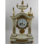 In the Louis XVI style, a pendule portique white marble clock, having eight day cylinder movement,