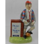 Claynger pottery, England. A ceramic figure of a schoolboy in uniform, advertising Palace at