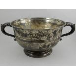 A silver twin-handled bowl, hallmarked Chester 1922. D.25cm