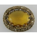 A 19th century Scottish style gilt metal oval pin brooch,