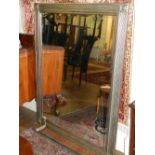 A Contemporary silver gilt framed mirror, having bevelled plate and ribbed border. H.140cm W.