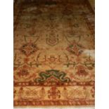 A Persian cream ground carpet, decorated in the ziegler palette, having floral design within many