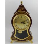 A 19th century style bracket clock, having waisted case, dial with Roman numerals. H.