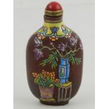 A Chinese snuff bottle, polychrome decorated with flowers in vases. H.7.