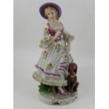 A Continental porcelain figurine of a young girl with her dog, raised on stylised base.