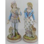 A pair of Continental porcelain figurines of male and female hunter. H.