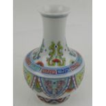 A Chinese doucai porcelain vase, decorated with scrolls and flower heads to neck,