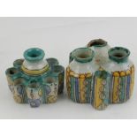 Two Moroccan polychrome decorated pottery inkwells.