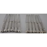 A rare set of 12 George IV Scottish Kings pattern table knives with silver blades and handles,