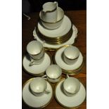 A Foley porcelain 29 piece coffee service with gilt Greek key band